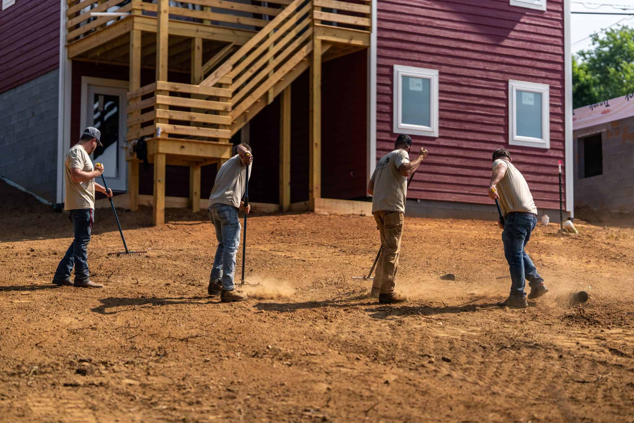 bucktom services workers clearing a lot for hardscaping 1.jpg